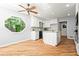 Well-lit kitchen featuring white cabinets, stainless steel appliances, and a large window overlooking the backyard at 4700 Township Walk, Marietta, GA 30066
