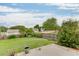 Spacious, fenced backyard featuring a swing set, lush grass, and a concrete patio, ideal for Gathering gatherings at 5555 Sugar Crossing Dr, Sugar Hill, GA 30518