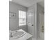 Bathroom featuring a vanity and shower/bathtub combo at 5555 Sugar Crossing Dr, Sugar Hill, GA 30518