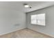Bedroom with carpet flooring and natural light from a large window at 5555 Sugar Crossing Dr, Sugar Hill, GA 30518