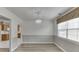 Elegant dining room featuring stylish chandelier and adjacent access to the kitchen and living area at 5555 Sugar Crossing Dr, Sugar Hill, GA 30518