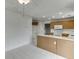 Updated kitchen with white countertops, white tile floor and stainless steel microwave, and eat in area at 5555 Sugar Crossing Dr, Sugar Hill, GA 30518