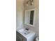 Bathroom vanity featuring a white countertop and mirror with modern lighting at 725 S Fork Sw Dr, Marietta, GA 30008