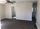 Inviting living room with updated flooring, fresh paint, and an open doorway at 725 S Fork Sw Dr, Marietta, GA 30008