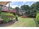 Picturesque backyard featuring lush greenery, mature trees, a multi-level deck, and well-maintained landscaping at 116 Patrick Way, Marietta, GA 30064