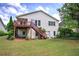 Well-maintained backyard featuring a deck, lush lawn, and mature trees at 116 Patrick Way, Marietta, GA 30064
