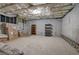 Unfinished basement with concrete walls and floors, ready for customization and storage at 116 Patrick Way, Marietta, GA 30064