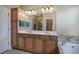 Bathroom with double vanity, a large mirror, and a soaking tub at 116 Patrick Way, Marietta, GA 30064