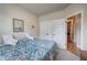 Bedroom with a full-size bed, double closets, and an open doorway to the hallway at 116 Patrick Way, Marietta, GA 30064