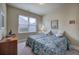 Cozy bedroom featuring two twin beds, a dresser, and a bright window with natural light at 116 Patrick Way, Marietta, GA 30064