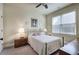 Bedroom features a brass bed frame, side tables with lamps, and a large window at 116 Patrick Way, Marietta, GA 30064