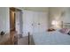 Bedroom with a decorative lamp, double closets, and a bed with a brass frame at 116 Patrick Way, Marietta, GA 30064