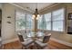 Bright breakfast nook with a round glass table and views of the back yard at 116 Patrick Way, Marietta, GA 30064