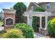 Welcoming community entrance sign amid lush landscaping and stone accents, creating a charming neighborhood ambiance at 116 Patrick Way, Marietta, GA 30064