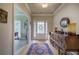 Inviting foyer with hardwood floors, a stylish rug, and decorative furniture at 116 Patrick Way, Marietta, GA 30064