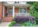 Inviting front porch with brick steps, white railing, and tasteful landscaping at 116 Patrick Way, Marietta, GA 30064