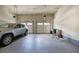 Well-lit two-car garage offering plenty of space for vehicles and storage, featuring neutral walls and high ceilings at 116 Patrick Way, Marietta, GA 30064