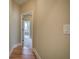 Hallway with hardwood floors leading to a bathroom with a shower and tub combo at 116 Patrick Way, Marietta, GA 30064