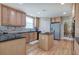 Well-lit kitchen featuring wood cabinets, granite countertops, and stainless steel refrigerator at 116 Patrick Way, Marietta, GA 30064