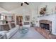 Inviting living room with brick fireplace and white sofas at 116 Patrick Way, Marietta, GA 30064