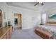 Inviting main bedroom with a walk-in closet, a king bed, and a neutral color palette at 116 Patrick Way, Marietta, GA 30064