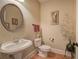 Cozy powder room with a pedestal sink and decorative accents at 116 Patrick Way, Marietta, GA 30064