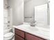 Well-lit bathroom with vanity, white marbled countertop, shower and tub combo at 12348 Hillcrest Dr, Hampton, GA 30228