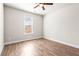 This bedroom is a serene space offering a ceiling fan, neutral color palette, and inviting atmosphere at 12348 Hillcrest Dr, Hampton, GA 30228