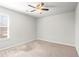 Bedroom showcasing neutral carpet, walls, natural light and ceiling fan at 12348 Hillcrest Dr, Hampton, GA 30228