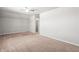 Large bonus room with carpet and view to closet area and neutral painted walls at 12348 Hillcrest Dr, Hampton, GA 30228