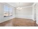 Dining area with hardwood floors, natural light, and elegant wainscoting at 12348 Hillcrest Dr, Hampton, GA 30228