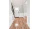 Inviting foyer with hardwood floors, staircase, and classic white wainscoting at 12348 Hillcrest Dr, Hampton, GA 30228