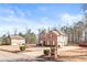 Attractive two-story brick home with a well-manicured lawn and driveway at 12348 Hillcrest Dr, Hampton, GA 30228