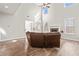 Cozy living room boasts vaulted ceiling, fireplace, and a view to the adjacent dining area at 12348 Hillcrest Dr, Hampton, GA 30228