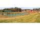 Well-maintained pickleball courts in a park setting, perfect for sports and outdoor recreation at 12348 Hillcrest Dr, Hampton, GA 30228