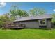 Exterior of house with a deck overlooking a spacious, grassy backyard at 1280 Gin House Ln, Lawrenceville, GA 30045