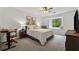 Comfortable bedroom with neutral decor, a plush bed and carpet, and natural light from the window at 1280 Gin House Ln, Lawrenceville, GA 30045