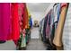 Spacious walk-in closet with organized storage, providing ample space for clothing and accessories at 1280 Gin House Ln, Lawrenceville, GA 30045
