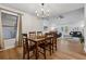 Dining room view of a hardwood floors, dining set and bright open living space at 1280 Gin House Ln, Lawrenceville, GA 30045