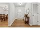 Entryway with hardwood floors, white door, complemented by a stylish table and modern decor at 1280 Gin House Ln, Lawrenceville, GA 30045
