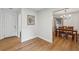 Hallway view of the dining area with hardwood floors and white walls at 1280 Gin House Ln, Lawrenceville, GA 30045