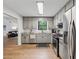 Updated kitchen features stainless steel appliances, light gray cabinetry and granite countertops at 1280 Gin House Ln, Lawrenceville, GA 30045