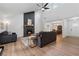 Spacious living room with a fireplace, hardwood floors, and views of the entryway and dining area at 1280 Gin House Ln, Lawrenceville, GA 30045