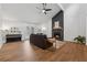 Open living area showcasing hardwood floors, fireplace, and a welcoming atmosphere with ample natural light at 1280 Gin House Ln, Lawrenceville, GA 30045