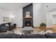 Cozy living room features a striking fireplace, vaulted ceilings, and comfortable seating arrangement at 1280 Gin House Ln, Lawrenceville, GA 30045