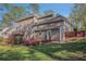 Picturesque backyard featuring a well-maintained lawn, mature trees, and a multi-level deck, perfect for outdoor enjoyment at 1627 Isham Dr, Lawrenceville, GA 30046