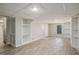 Finished basement with built-in shelving and a door to the backyard at 1627 Isham Dr, Lawrenceville, GA 30046