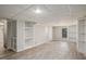 Finished basement with built-in shelving and walkout to the backyard at 1627 Isham Dr, Lawrenceville, GA 30046