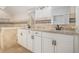 Elegant bathroom with double vanity, granite counters, tiled walls, and modern fixtures at 1627 Isham Dr, Lawrenceville, GA 30046