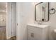 Powder room with modern vanity, fixtures, and wood flooring at 1627 Isham Dr, Lawrenceville, GA 30046